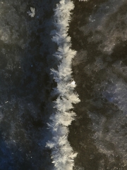 Ice-frost-crystals-growing-from-a-crack